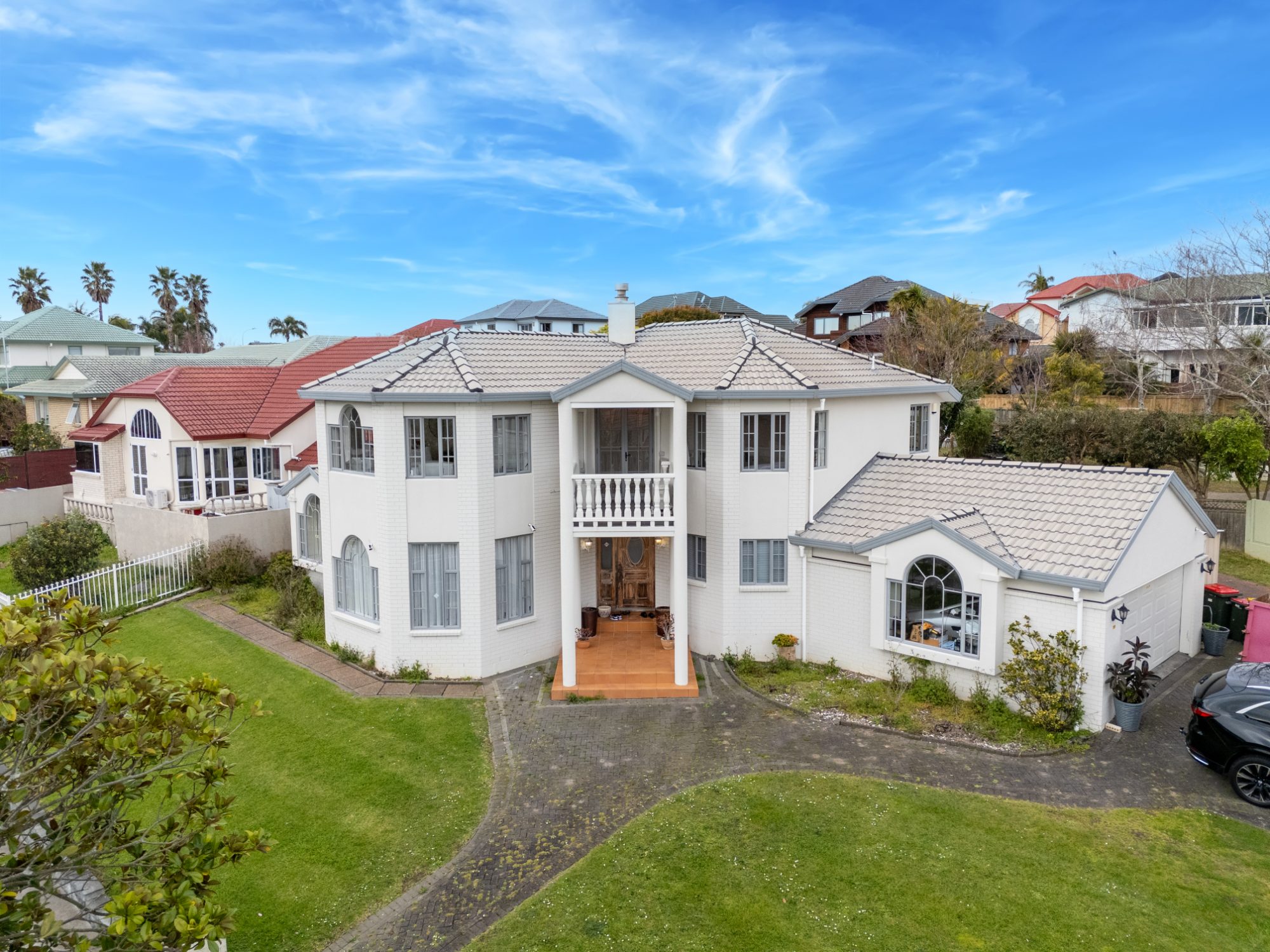 Aerial photo of a large two-storey white home in Dannemora