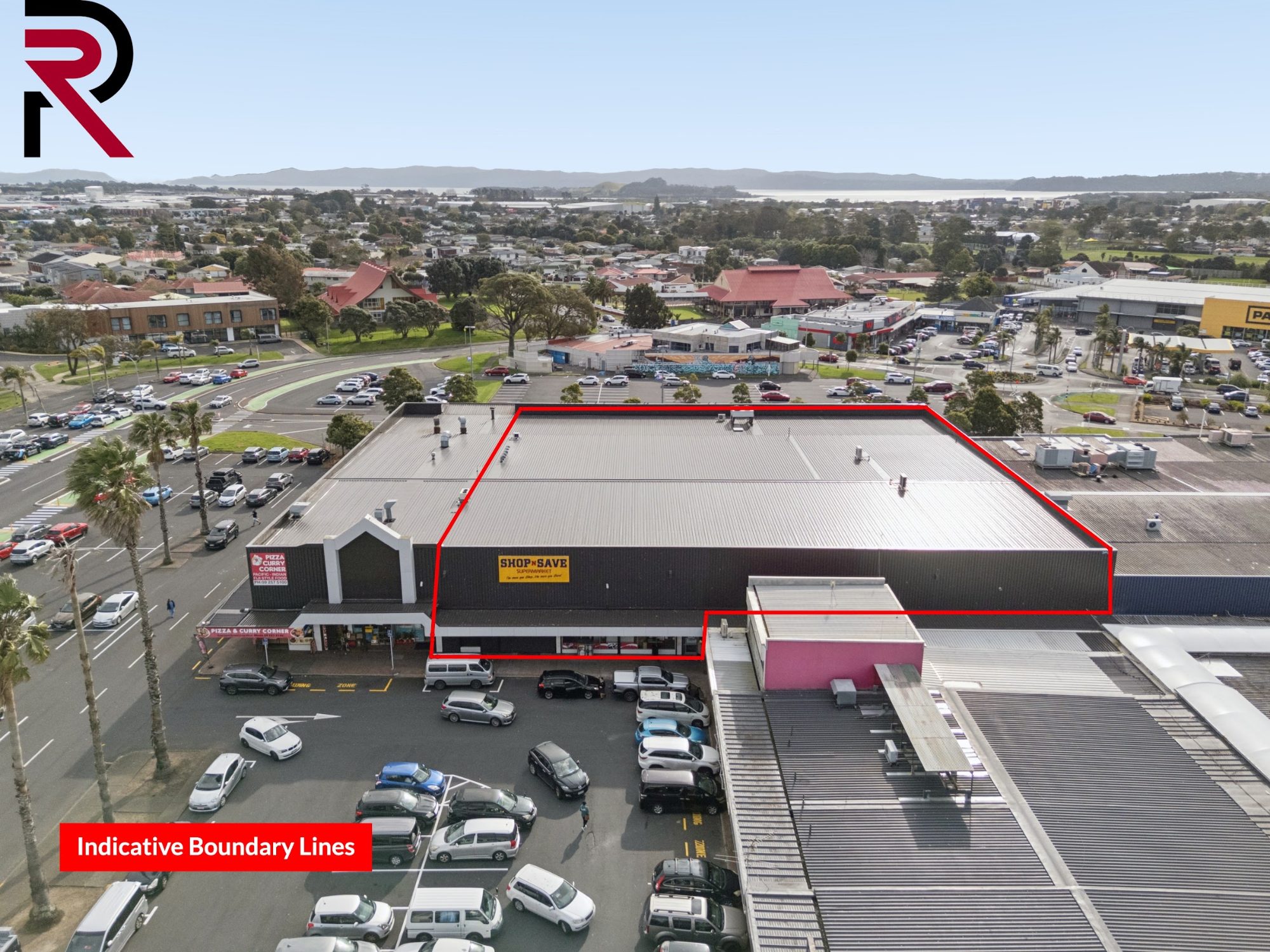 Aerial photo of a commercial retail site and car park in Māngere