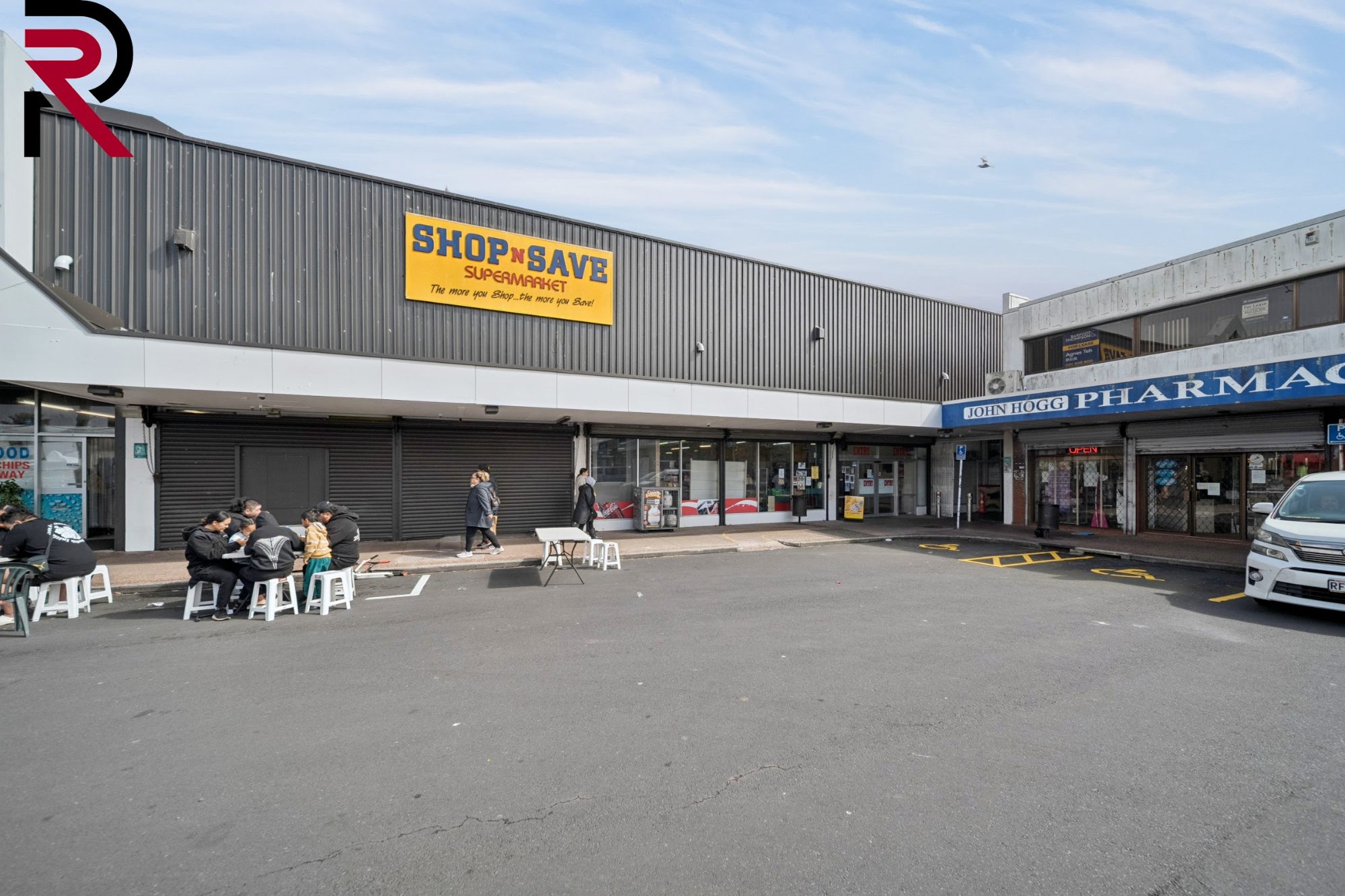 Retail shopfront and pharmacy frontage in Māngere