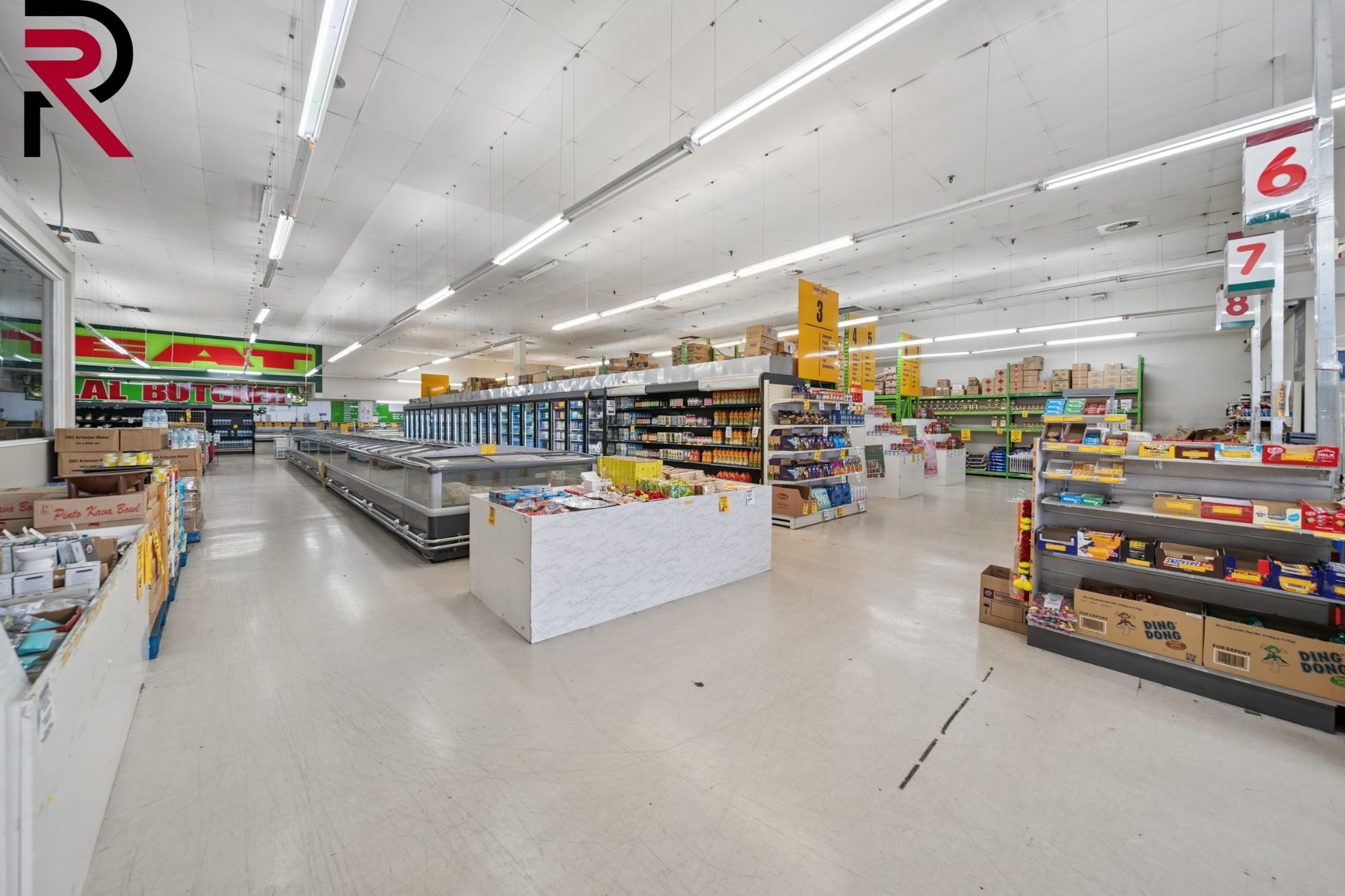 Supermarket interior with produce stands and aisles in Māngere