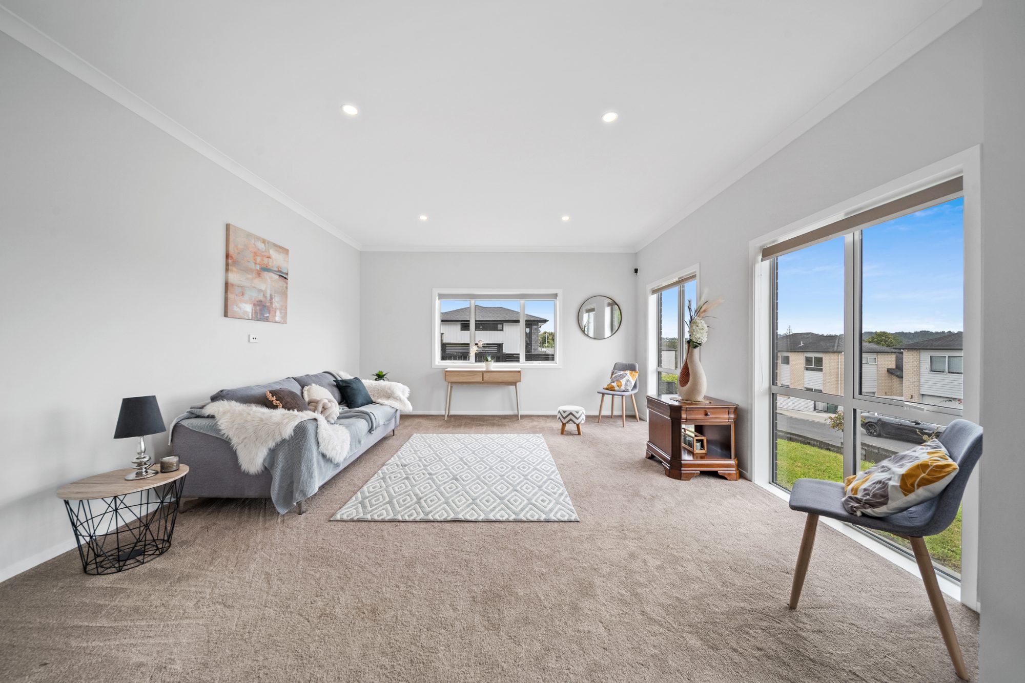 Living room with sliding doors to the garden in a Ranui home