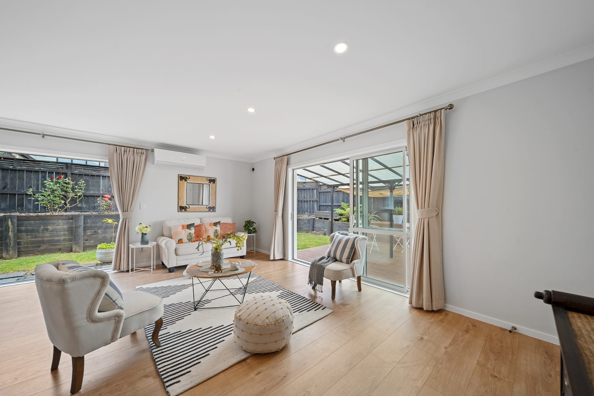 Styled lounge with armchairs in a Ranui home
