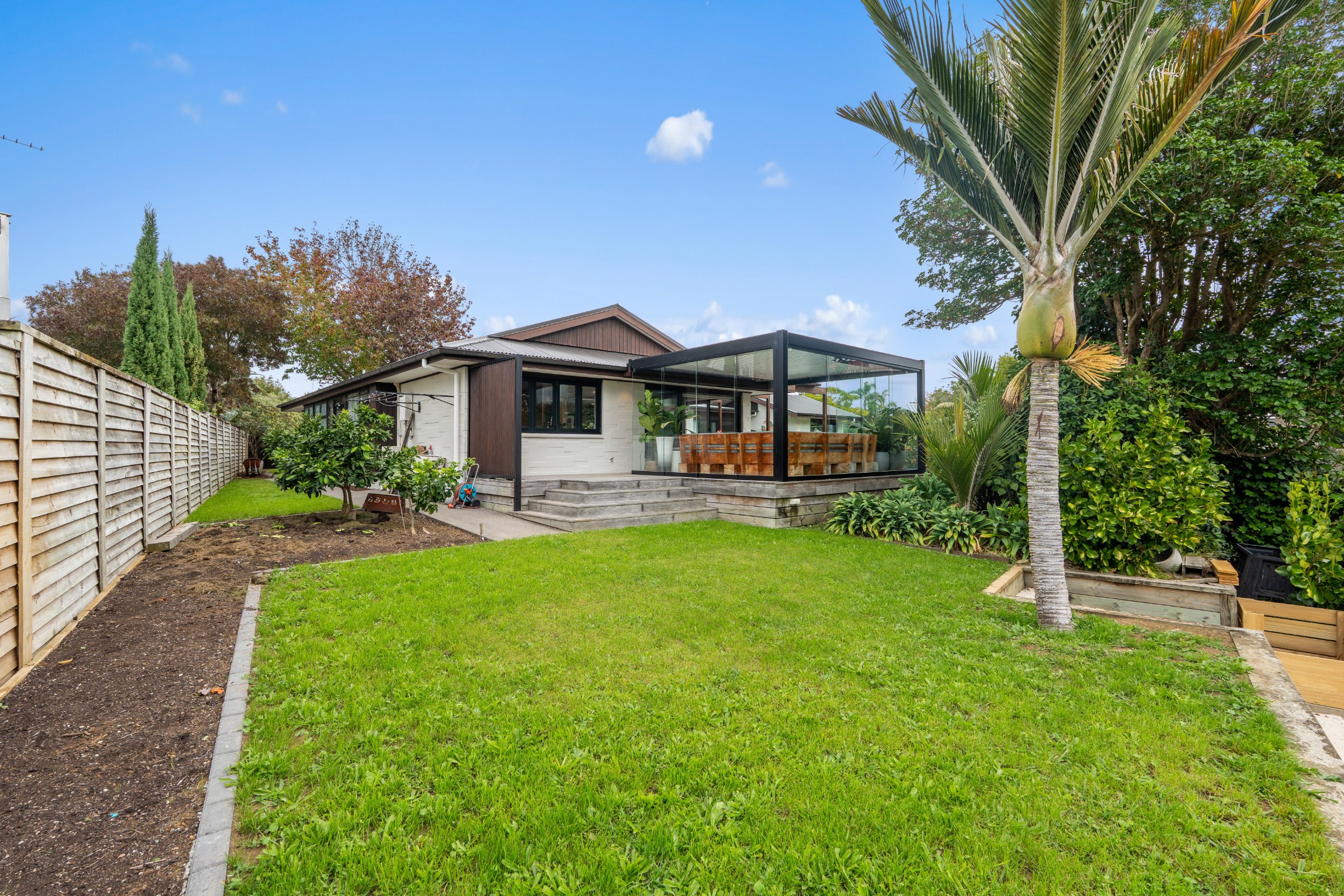 Lawn and garden at the back of a home in St Heliers