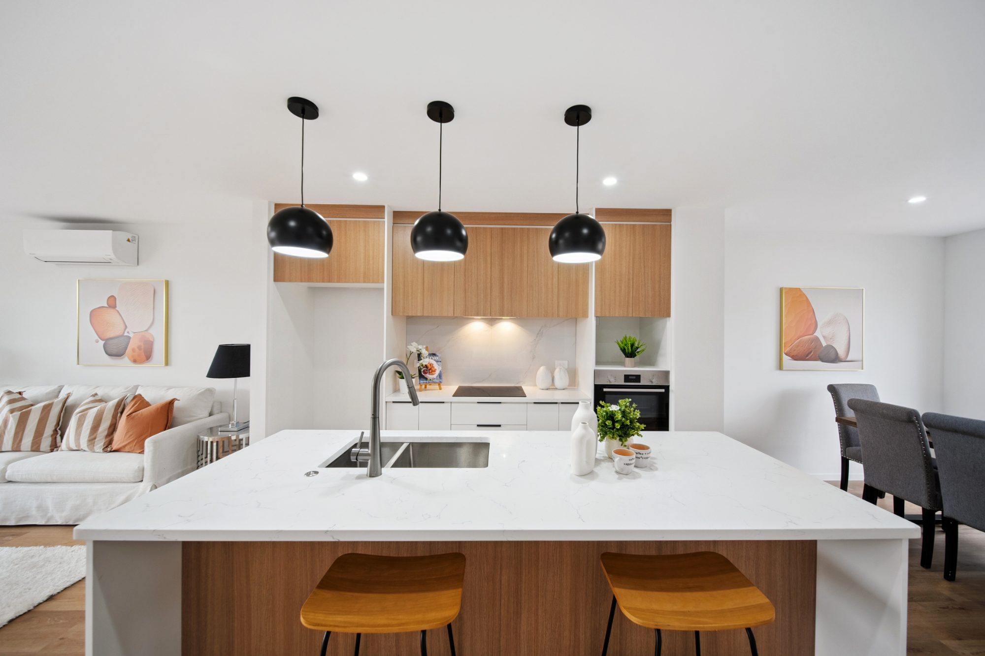 Kitchen with island and pendant lights in a Takanini home